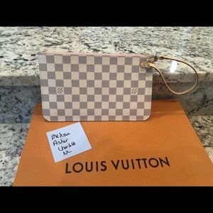 Louis  Vuitton neverfull pouch or wristlet.